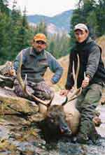 Elk hunters with their prize
